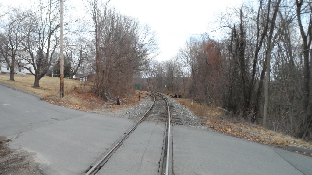 Looking northeast at the North Whitney Street train crossing in Amherst, Massachusetts